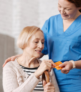 woman giving medicine